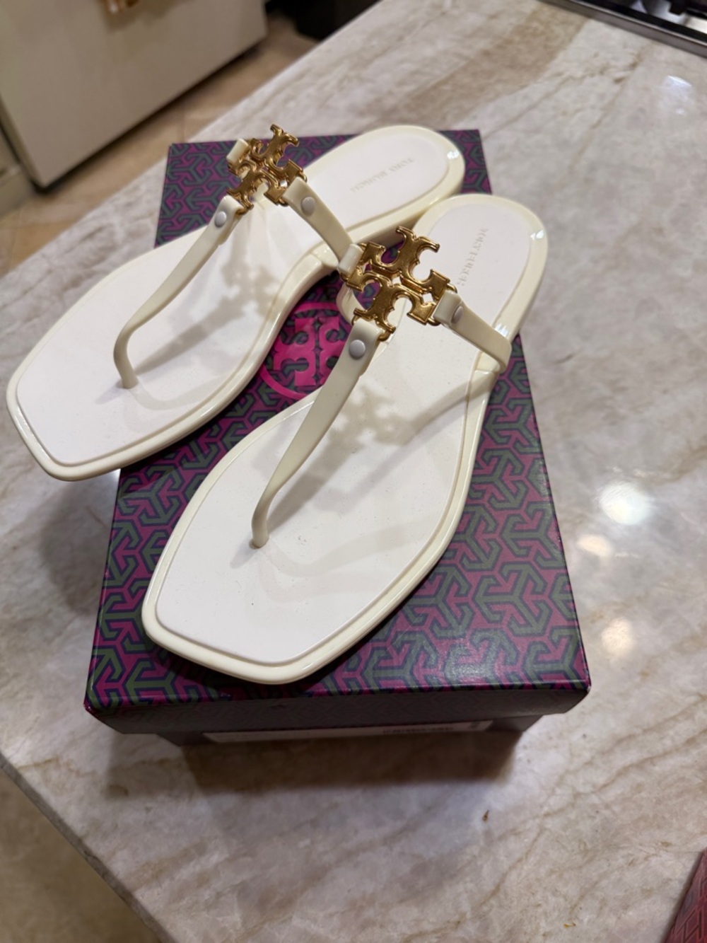 Tory Burch Ivory Roxanne Jelly Sandals with Gold Logo Medallion